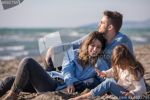 Image of Young family enjoying vecation during autumn