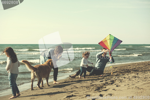 Image of happy young family enjoying vecation during autumn day