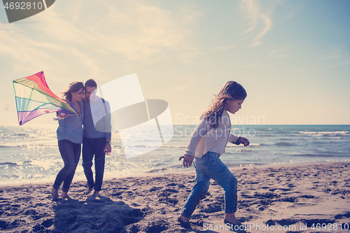 Image of happy family enjoying vecation during autumn day