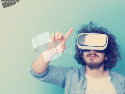 Image of man using VR headset glasses of virtual reality