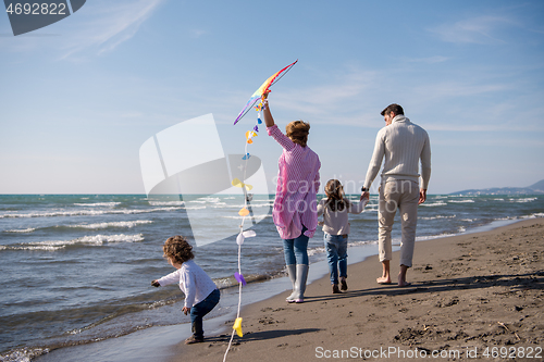 Image of happy family enjoying vecation during autumn day