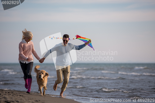 Image of happy couple enjoying time together at beach