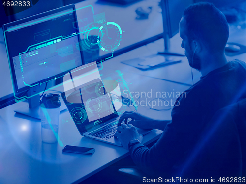 Image of businessman working using a laptop in startup office