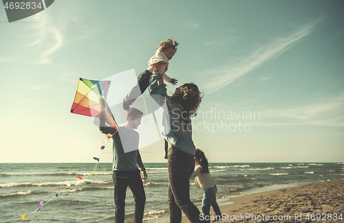 Image of happy family enjoying vecation during autumn day
