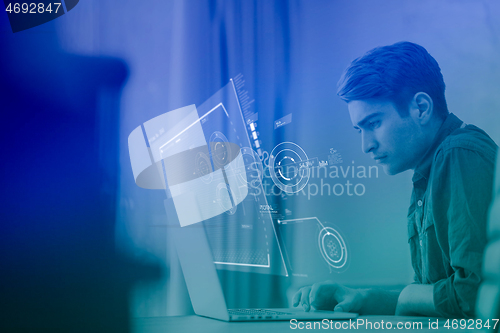 Image of businessman working using a laptop in startup office