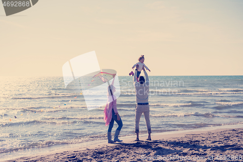 Image of happy family enjoying vecation during autumn day