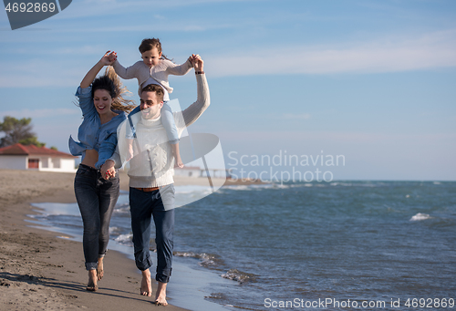 Image of Young family enjoying vecation during autumn