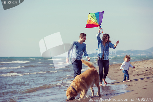 Image of happy young family enjoying vecation during autumn day