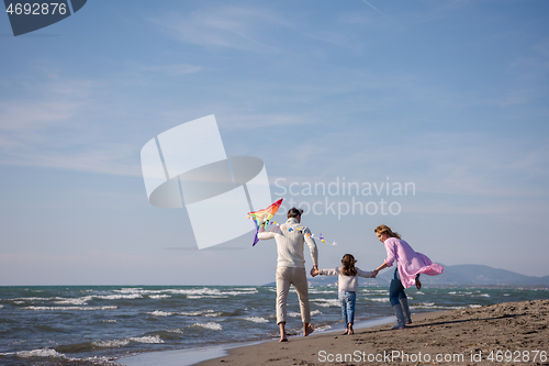 Image of happy family enjoying vecation during autumn day