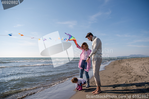 Image of happy family enjoying vecation during autumn day