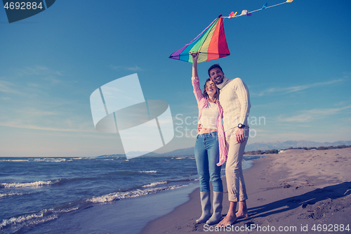 Image of Couple enjoying time together at beach