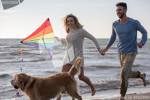 Image of happy couple enjoying time together at beach