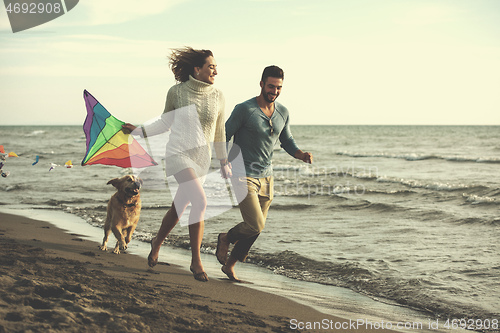 Image of happy couple enjoying time together at beach