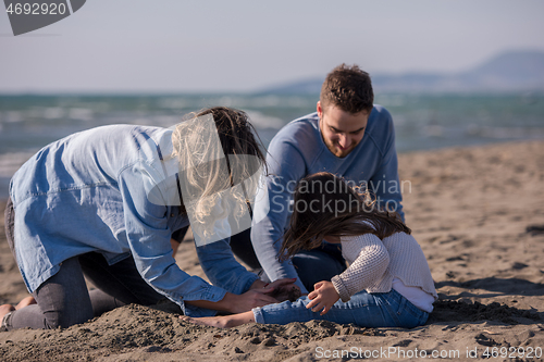 Image of Young family enjoying vecation during autumn