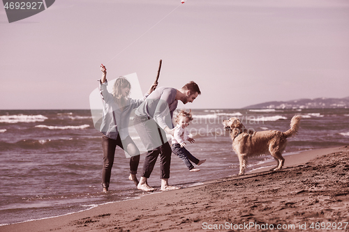 Image of happy young family enjoying vecation during autumn day