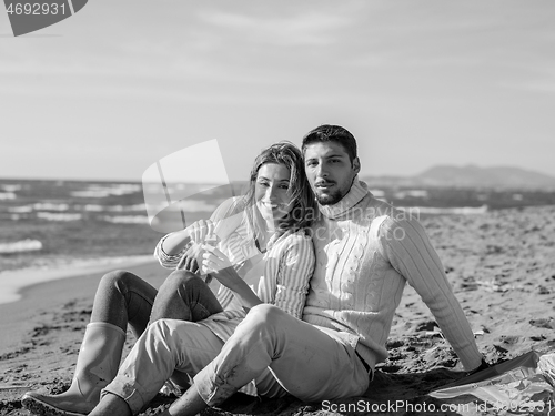 Image of young couple enjoying time together at beach