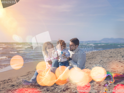 Image of Young family enjoying vecation during autumn day