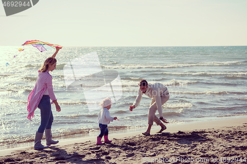 Image of happy family enjoying vecation during autumn day