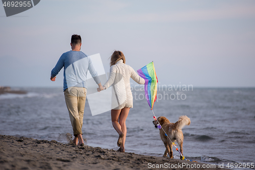 Image of happy couple enjoying time together at beach