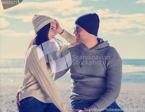 Image of Couple chating and having fun at beach bar