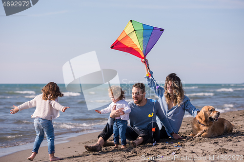 Image of happy young family enjoying vecation during autumn day