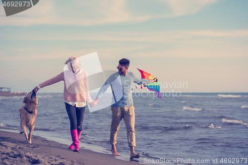 Image of happy couple enjoying time together at beach