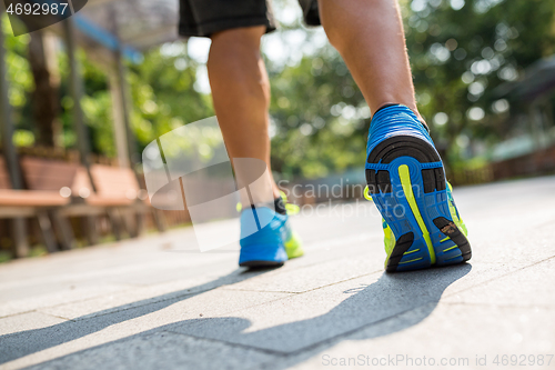 Image of Man running in a city