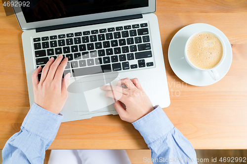 Image of Female using her laptop computer