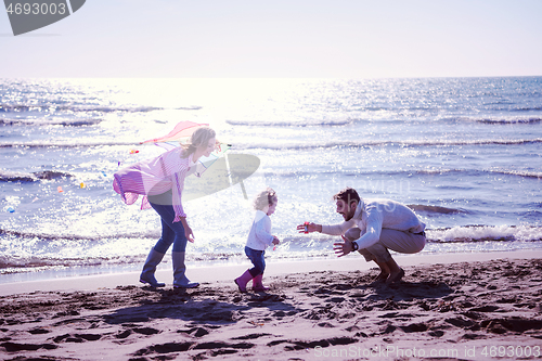 Image of happy family enjoying vecation during autumn day