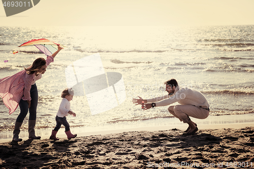 Image of happy family enjoying vecation during autumn day