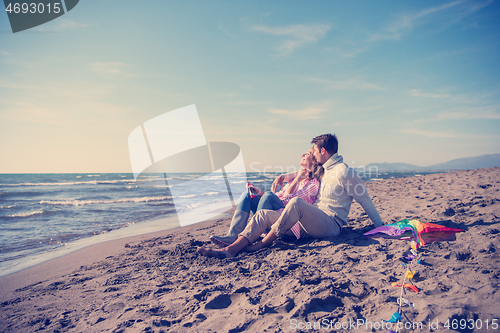 Image of young couple enjoying time together at beach