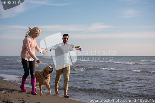 Image of happy couple enjoying time together at beach