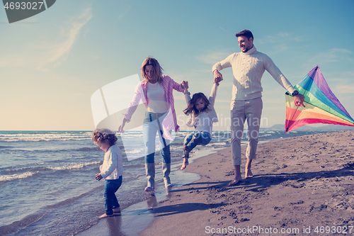 Image of happy family enjoying vecation during autumn day