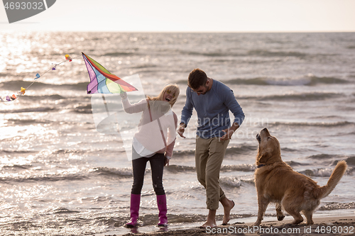 Image of happy couple enjoying time together at beach