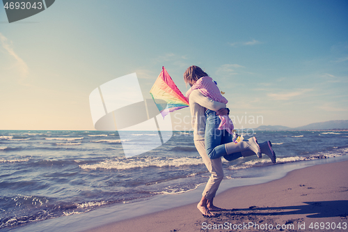 Image of Couple enjoying time together at beach