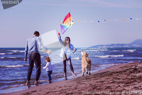 Image of happy young family enjoying vecation during autumn day