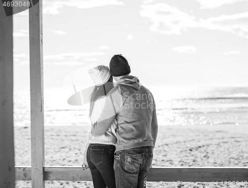 Image of Couple chating and having fun at beach bar