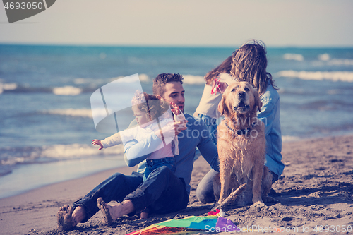 Image of happy young family enjoying vecation during autumn day