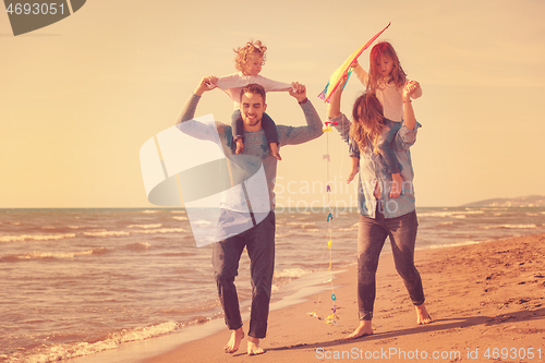Image of happy family enjoying vecation during autumn day