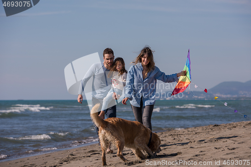 Image of happy young family enjoying vecation during autumn day