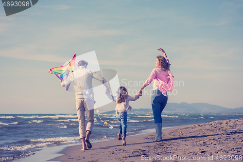 Image of happy family enjoying vecation during autumn day