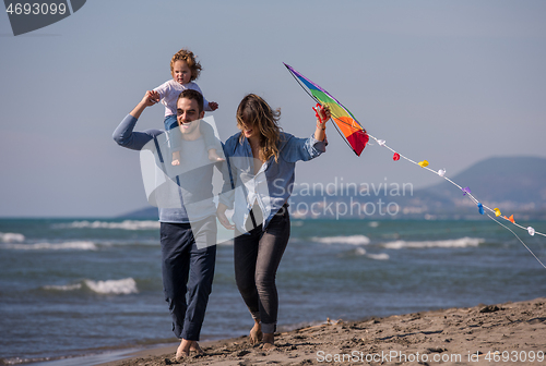 Image of happy family enjoying vecation during autumn day