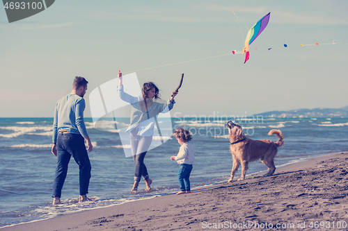 Image of happy young family enjoying vecation during autumn day