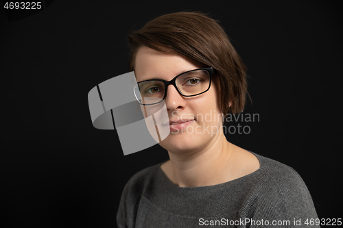 Image of young woman with glasses portrait