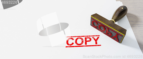 Image of red copy stamp on white paper background