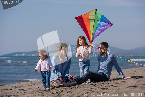 Image of happy family enjoying vecation during autumn day