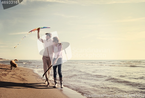 Image of happy couple enjoying time together at beach