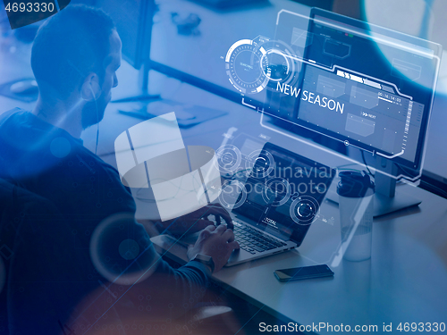 Image of businessman working using a laptop in startup office