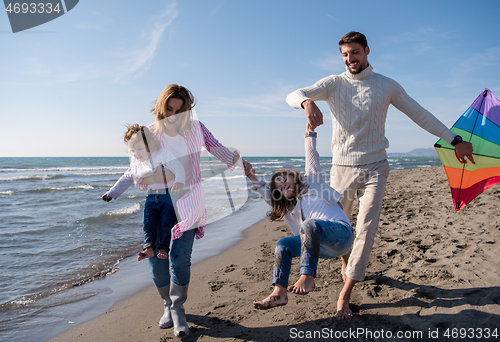 Image of happy family enjoying vecation during autumn day