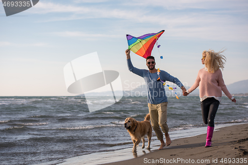 Image of happy couple enjoying time together at beach